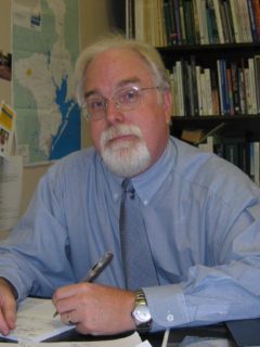 Dr. John Jacob at his desk