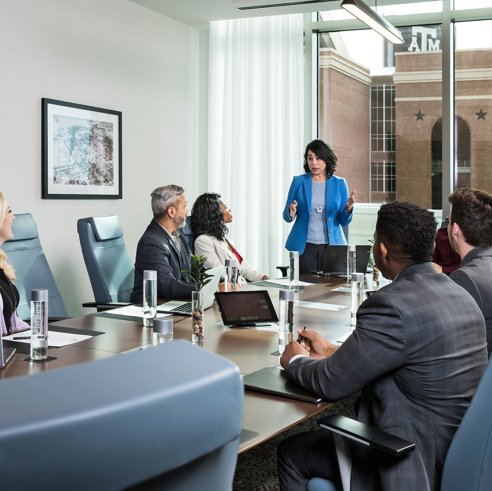 A woman leading a meeting in a conference room.