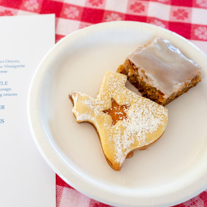 desserts on plate sitting on checkered tablecloth